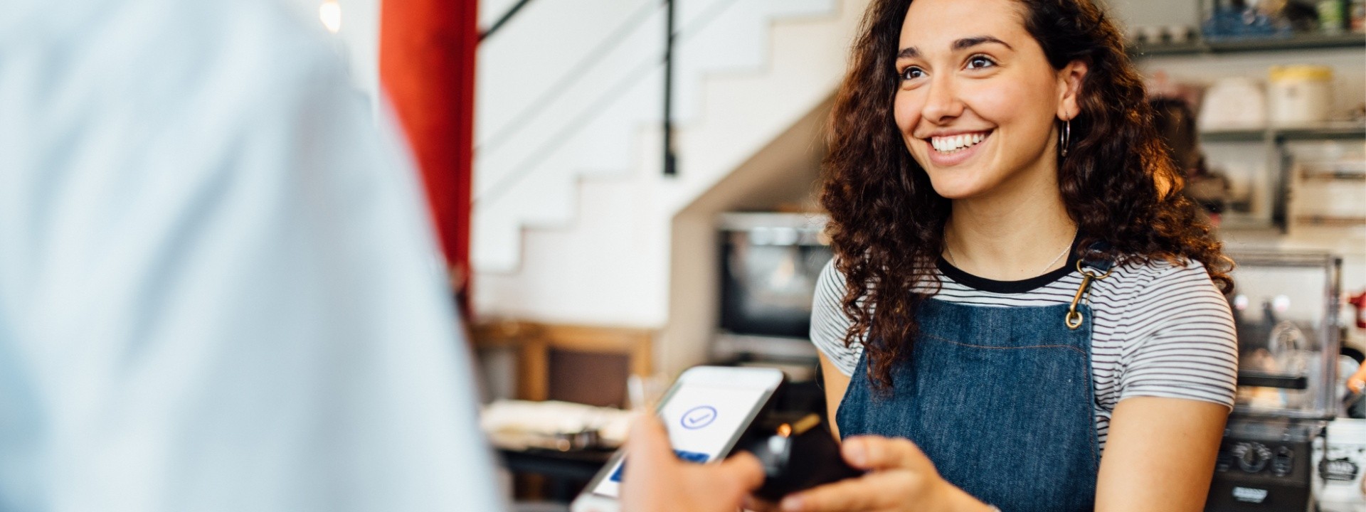 woman taking mobile payment