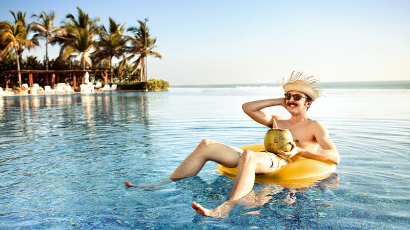 man floating on inflatable in the sea